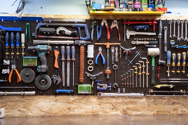 Plumbing tools hanging on a wall, ready for professional service